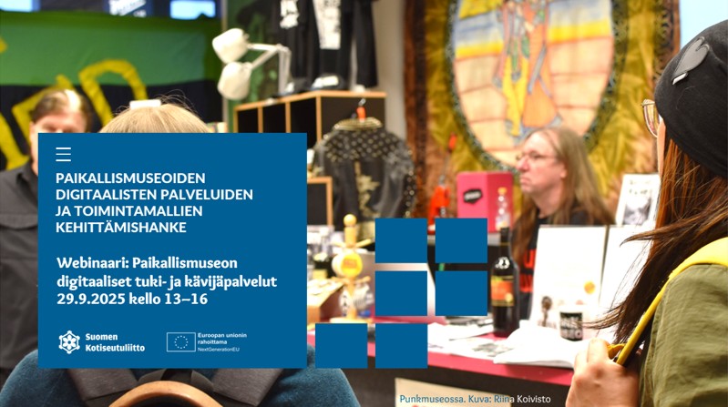 ihmisiä ja esineitä sisätilassa. Yksi istuu pöydän ääressä.